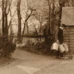 David Cooper's Great Grandfather Cooper wearing a yoke carrying milk bucket