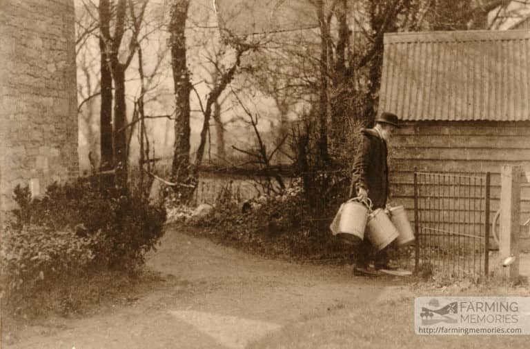 David Cooper's Great Grandfather Cooper wearing a yoke carrying milk bucket