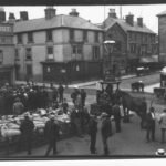 Black and white photograph which shows St James' Square, Newport cattle market before Victoria memorial