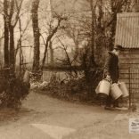 David Cooper's Great Grandfather Cooper wearing a yoke carrying milk bucket